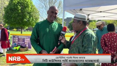 Man in a green kurta is interviewed outdoors by a reporter holding an NRB microphone under a white canopy, with an NRB TV banner in view.