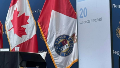 Stage with York Regional Police backdrop, Canadian flag and police flag, plus a display screen showing 'Project Dusk' and '20 suspects arrested'