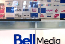 Bell Media Studios reception with a wall of TV channel logos behind a glass counter.